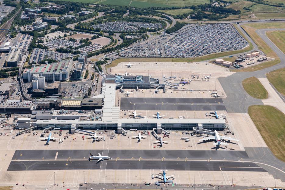 Aerial view of Birmingham International Airport terminals and airplanes.