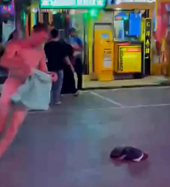 Aidan Jesse Phillimore dancing naked in the middle of Walking Street in Phuket.
