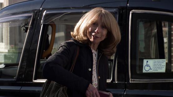 Audrey Roberts getting into a taxi.