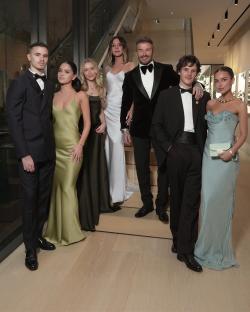 The Beckham family posing for a photo.