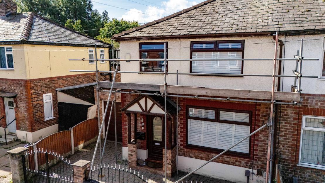 House with scaffolding around the front.