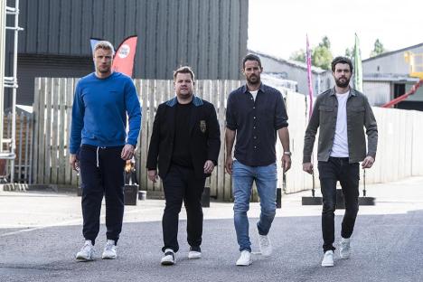 Four men walking together.