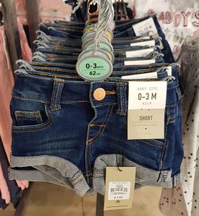 Baby denim shorts on display at Primark.