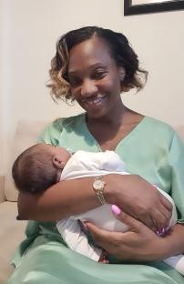 Woman holding her newborn baby.