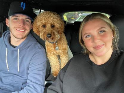 Declan Rice, his girlfriend, and their dog in a car.