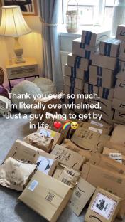 A large pile of parcels in a living room.