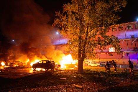 Firefighters battling a fire at the site of a Russian drone strike in Kyiv, Ukraine.