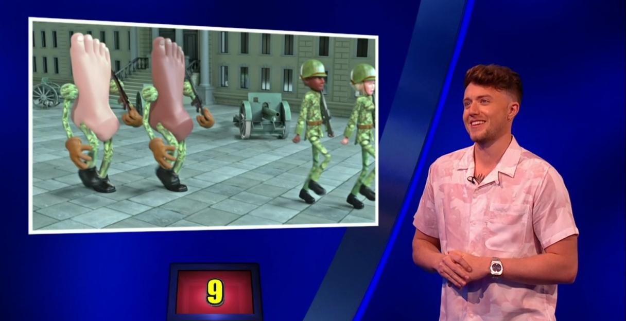 Roman Kemp on Celebrity Catchphrase, reacting to an animation of marching feet.