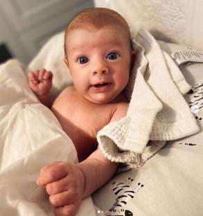 Photo of a baby wrapped in a blanket.
