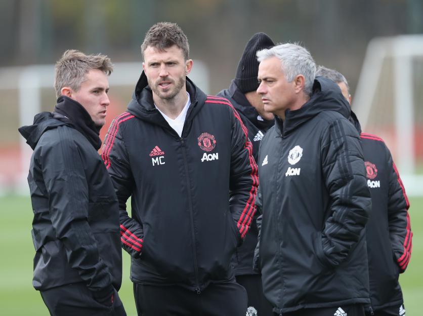 Coaches Kieran McKenna and Michael Carrick with Manager Jose Mourinho of Manchester United during a training session.