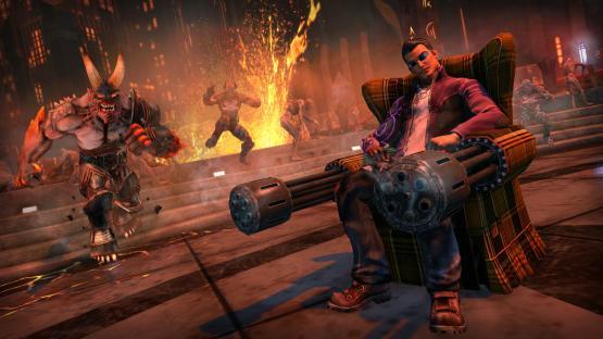 Saints Row video game screenshot: a man sits in a chair holding a large gun, surrounded by demons.