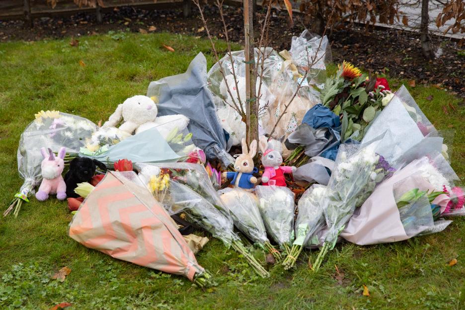 Flowers and stuffed animals left as a memorial.