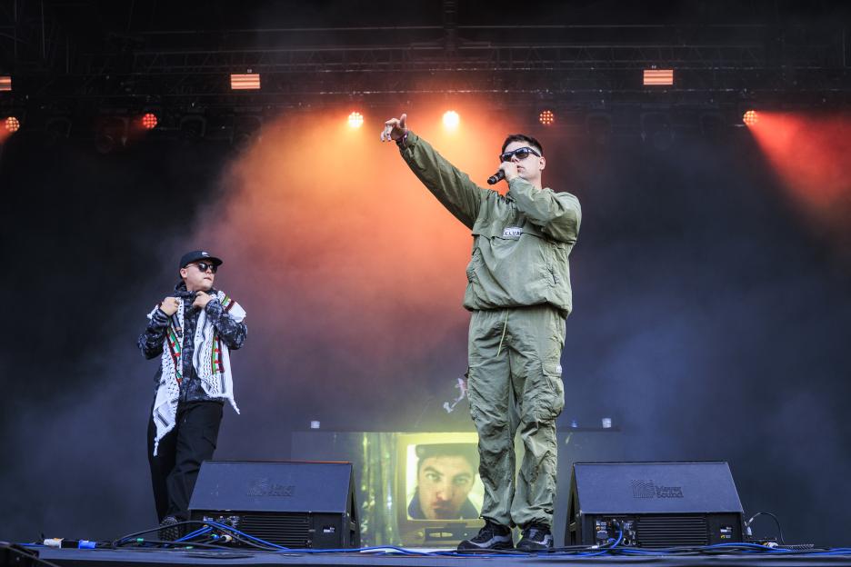 Kneecap performing on stage.