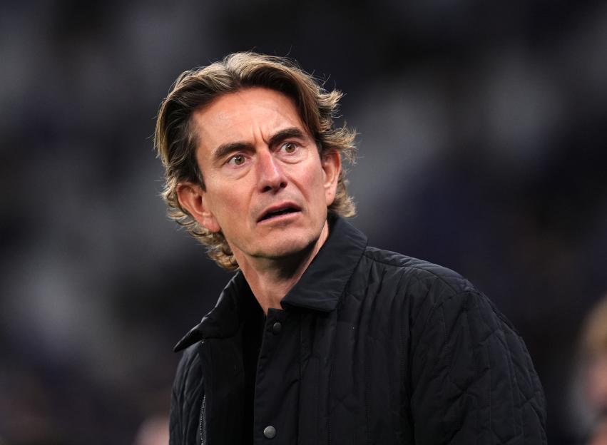 Thomas Frank, manager of Tottenham Hotspur, looking intently during a UEFA Champions League match.