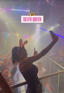 Katie Price taking a selfie at a nightclub.