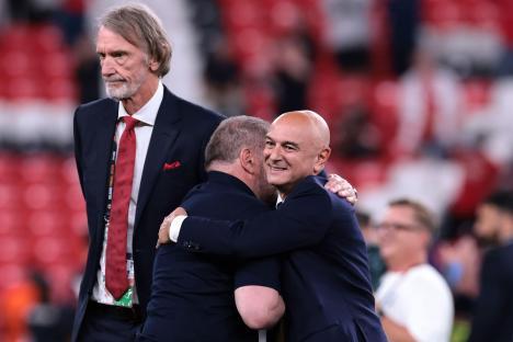 Sir Jim Ratcliffe, co-owner of Manchester United, and Daniel Levy, chairman of Tottenham Hotspur, applauding at a medal ceremony.