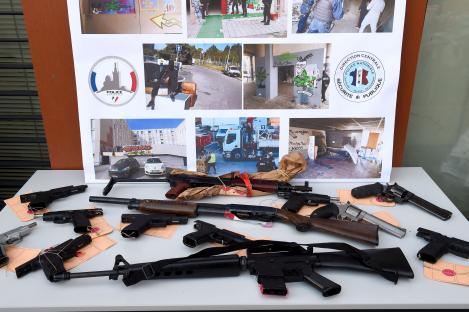 Seized weapons displayed with crime scene photos.