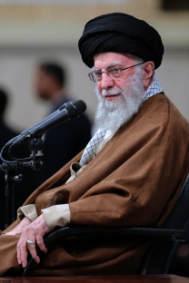 Portrait of Ayatollah Ali Khamenei speaking into a microphone.