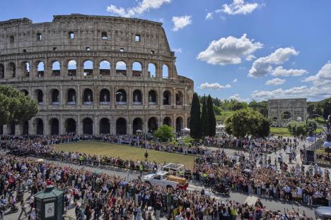 Pope Francis's coffin passing the Colosseum in Rome.