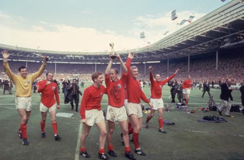 Bobby Charlton raising the Jules Rimet trophy after England's World Cup victory.