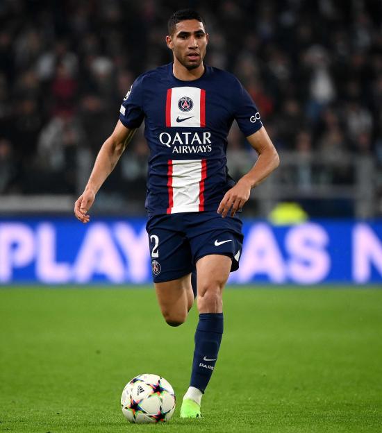 Achraf Hakimi, Paris Saint-Germain player, controlling the ball.