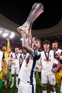 James Maddison of Tottenham Hotspur holding the Europa League trophy.