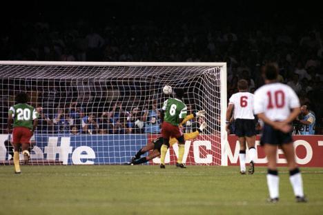 Emmanuel Kundé scoring a penalty goal against England's Peter Shilton.