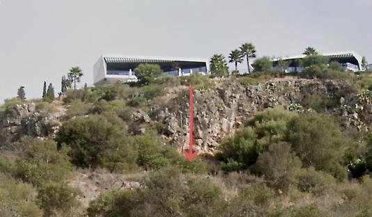 Photo of the accident scene where Greg Monks fell from a cliff near two villas.