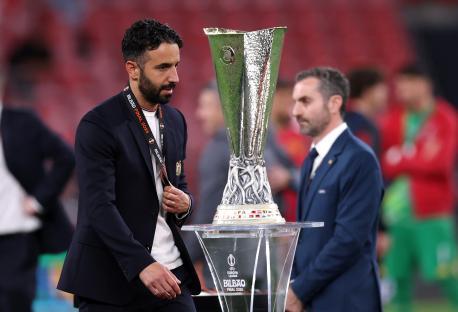 Ruben Amorim, Manchester United manager, near the UEFA Europa League trophy.