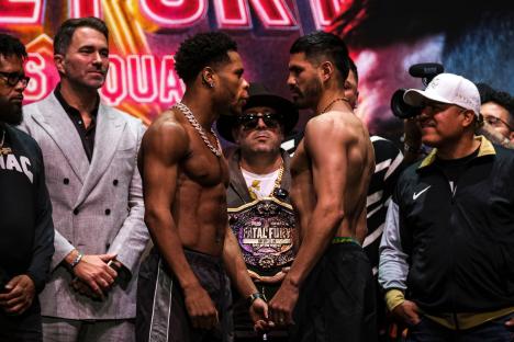 Devin Haney and Jose Ramirez facing off at a weigh-in.