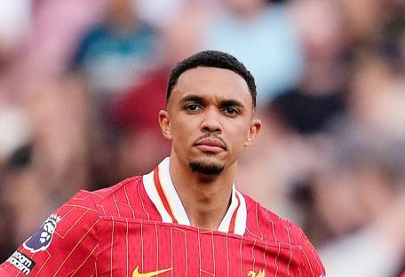 Trent Alexander-Arnold and Mohamed Salah looking dejected on the pitch.