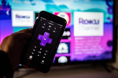 Smartphone displaying Roku remote app.
