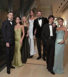 Family in formal wear at a birthday celebration.