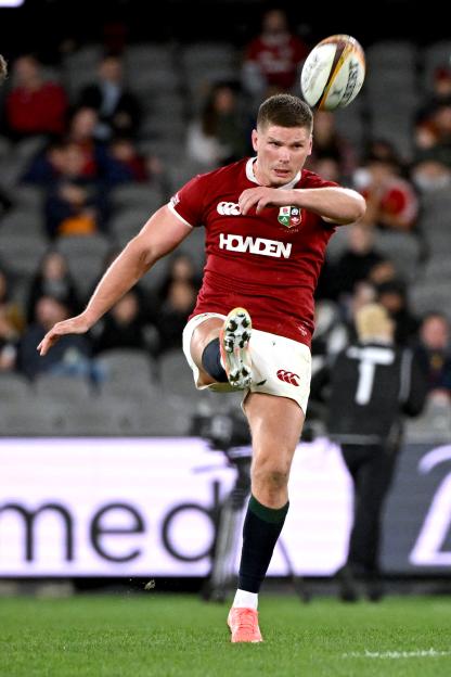 Owen Farrell, British and Irish Lions team captain, kicking a rugby ball.