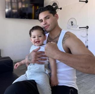 Ryan Garcia holding his son.