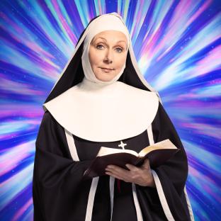 Nun holding a Bible against a colorful background.