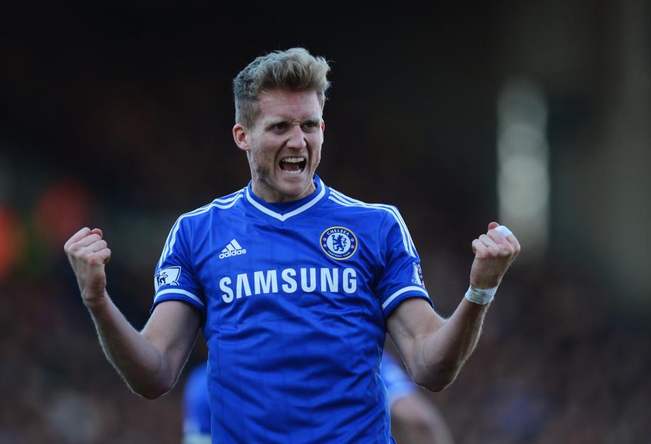 Andre Schürrle celebrating after scoring a goal for Chelsea.