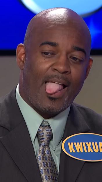 Family Feud contestant sticking out tongue.