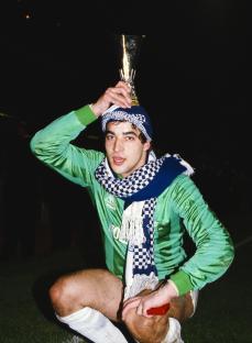 Tony Parks, Tottenham Hotspur goalkeeper, holding the UEFA Cup trophy after a penalty shootout win.