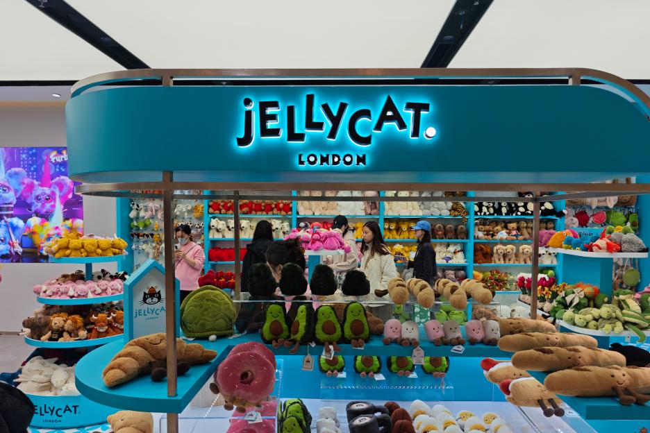 Customers shopping at a Jellycat stuffed animal store.