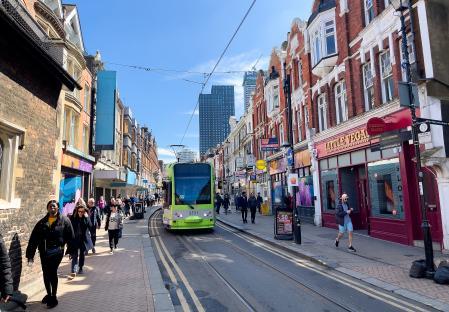Tram on a city street in Croydon, London.