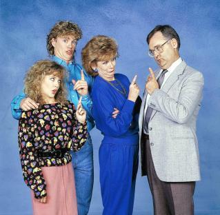 Photo of Kylie Minogue, Craig McLachlan, Anne Charleston, and Ian Smith from the TV show *Neighbours*.