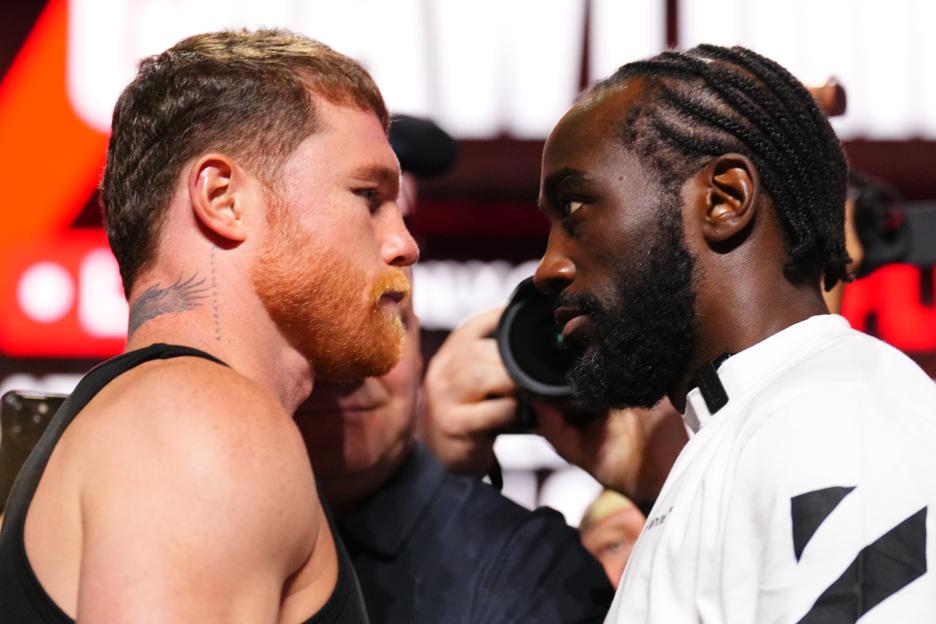 Canelo Alvarez and Terence Crawford face off at a press conference.