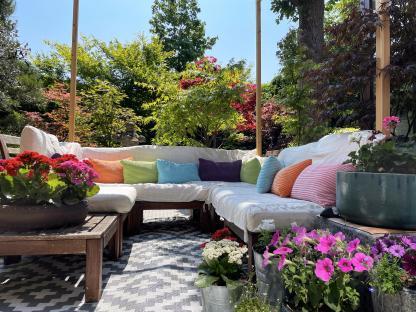 Outdoor lounge area in a Japanese-style garden.