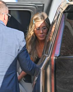 Jennifer Aniston getting into a car.