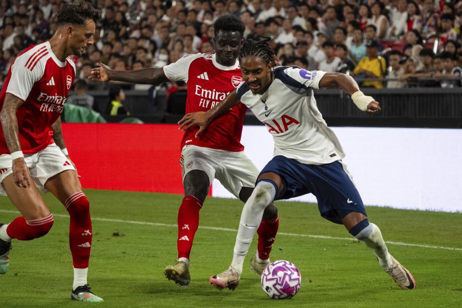 Bukayo Saka of Arsenal vying for the ball during a soccer match.