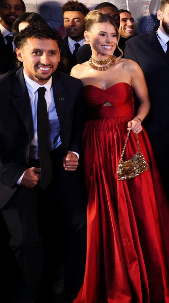 Paris Saint-Germain players and their partners posing at the Communities Foundation Gala.