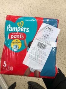 Package of Pampers baby-dry pants with a Tesco receipt showing a free Pampers offer.
