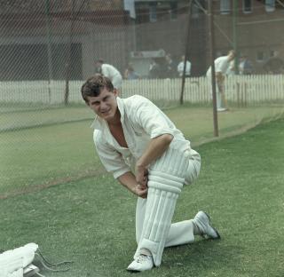 Bob Cowper, Australian cricketer, kneeling during net practice.