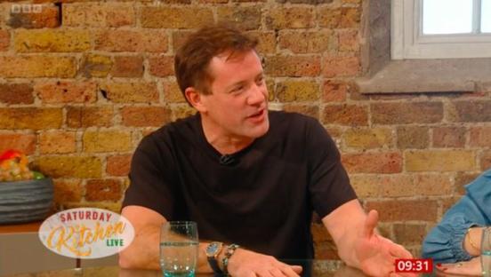 Matt Tebbutt, host of Saturday Kitchen Live, speaking on a television program.